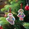 Superman and Superwoman Christmas ornaments. Personalized holiday tree decorations.