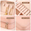 Pink PU leather jewelry organizer with multiple compartments for rings, earrings, necklaces, and watches, ideal gift for her.