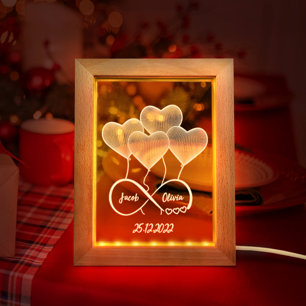 Custom infinity night light with personalized names and 3D heart design in a wooden frame, a perfect gift.