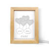 Custom night light with heart design and personalized names, wooden frame, perfect gift.
