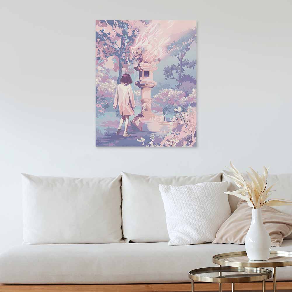 Canvas print of woman in pink coat in a dreamy forest, framed and hung on a wall above a white sofa, home decor.