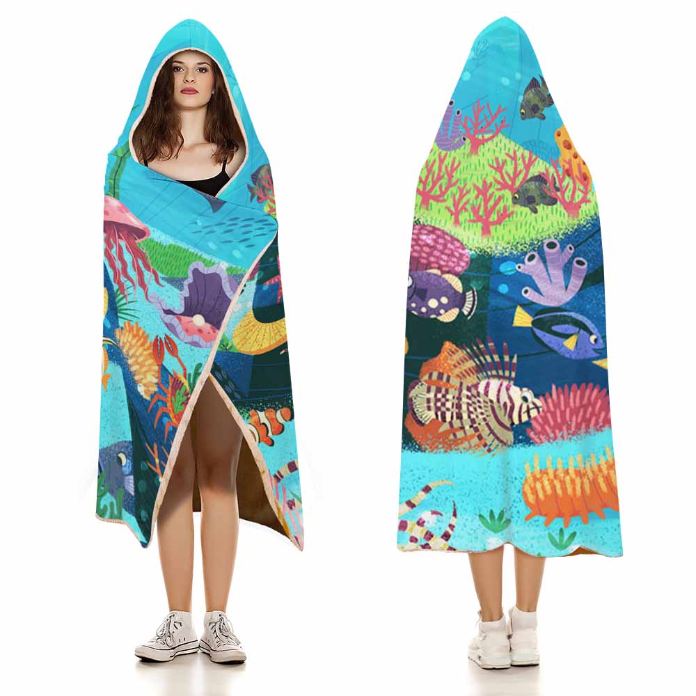 Cloak Hooded Blanket featuring an underwater coral and fish scene, crafted in Arctic Velvet for cozy lounging.