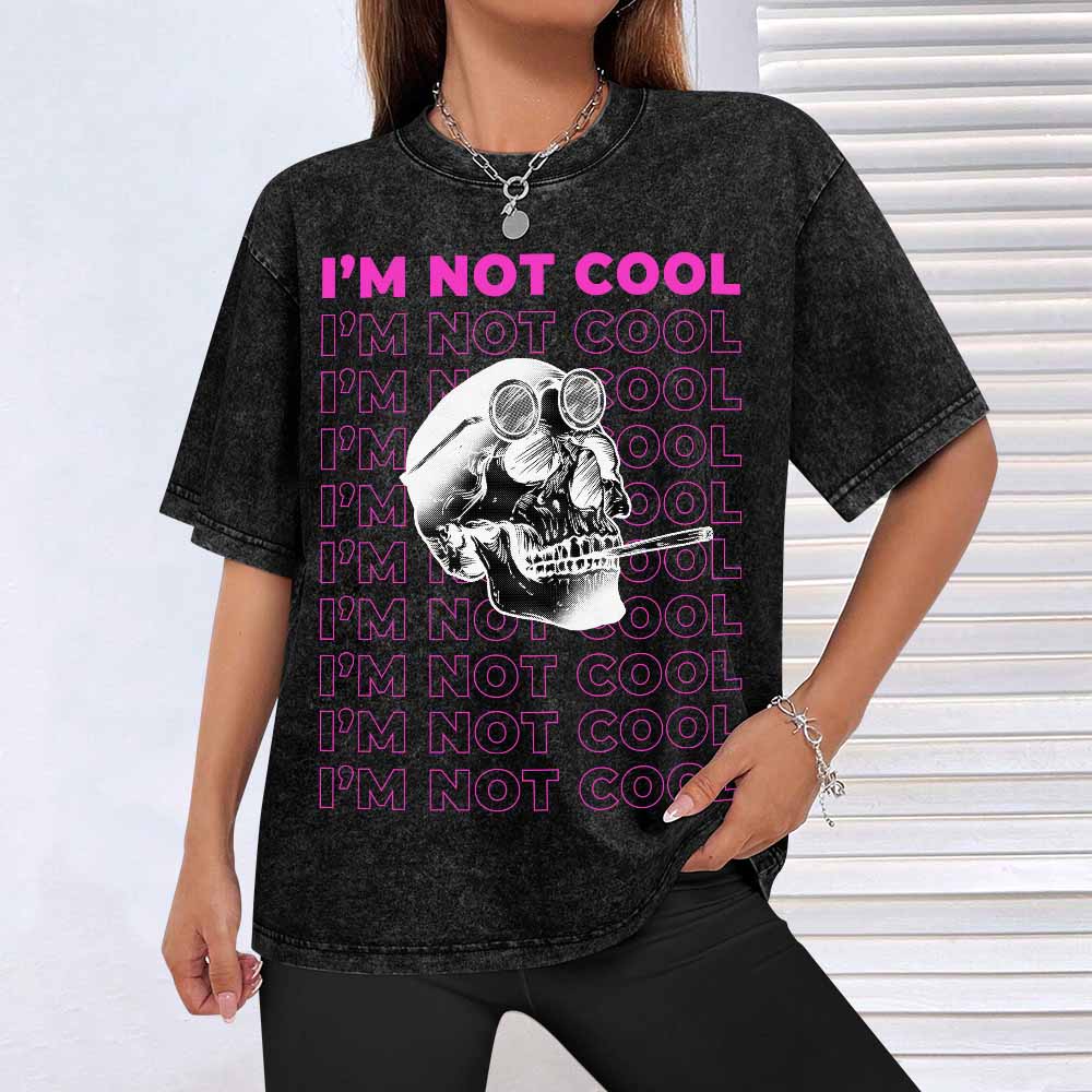 Black vintage wash off-shoulder short-sleeved T-shirt with skull graphic, I'M NOT COOL text, cotton