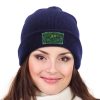 Navy knitted cap with custom logo on a woman, perfect for winter warmth and branded style.