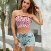 Pink floral tube top with black trim and denim shorts for summer casual style