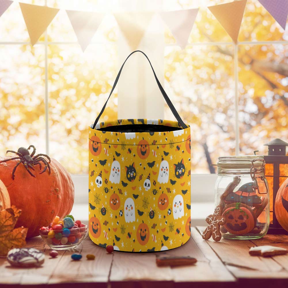 Yellow Halloween tote candy bag with ghost and pumpkin pattern, perfect for trick-or-treating and parties.