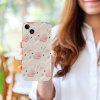 Beige iPhone 15 case with playful pink floral pattern, PC plastic, held by a woman