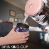 Stainless steel insulated cup being filled with liquid, drink cup