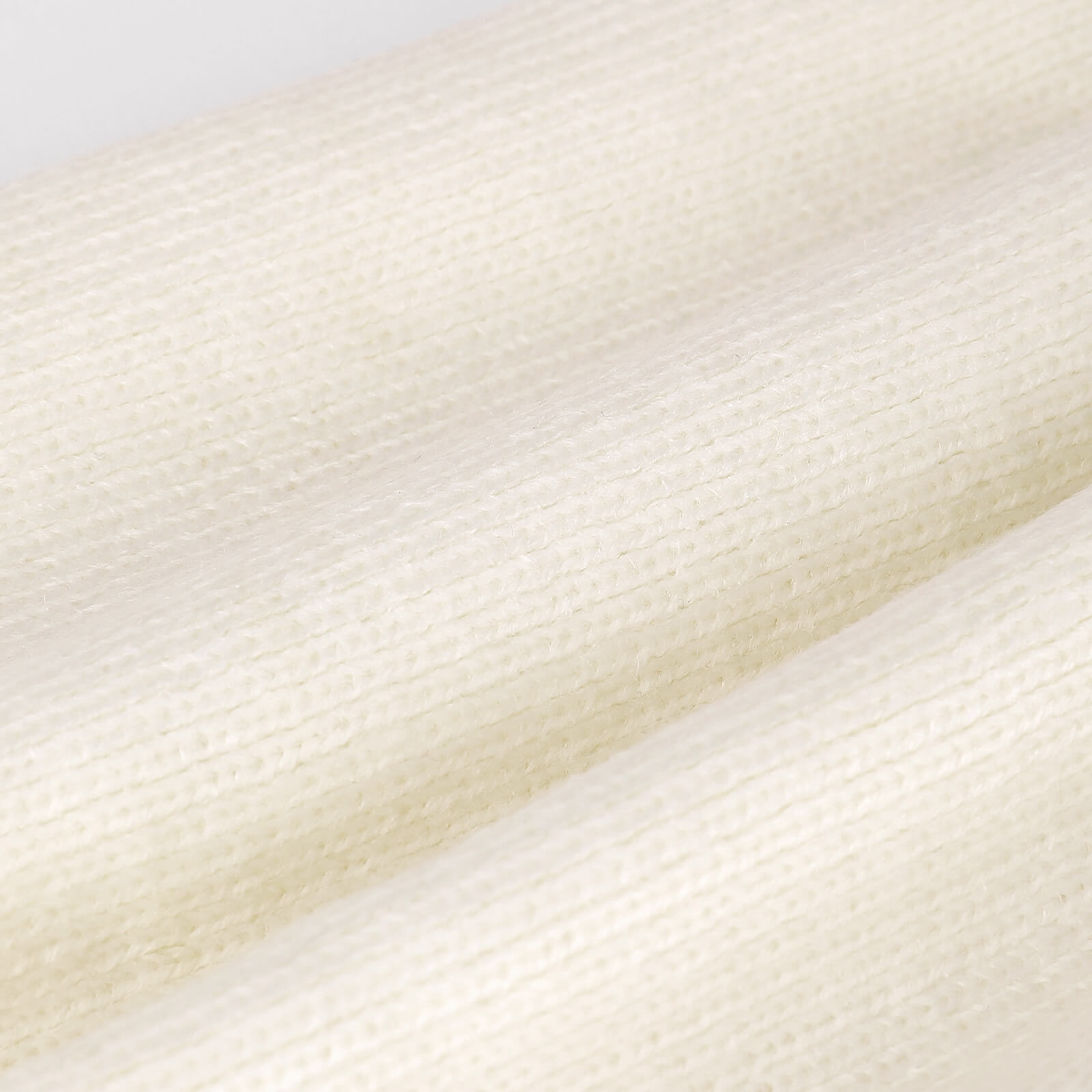 Close-up polyester knitted hat material, soft and warm, perfect for winter wear.