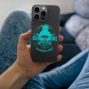iPhone 13 case featuring 'Stay True Christmas Dude' design, glow-in-the-dark, black TPU, wireless charging.