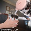 Stainless steel insulated cup being filled with liquid, Inkedjoy drink cup