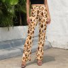 Beige animal print flared pants. Featuring a high-waist design, and comfortable elastic waistband. Suitable for casual wear.