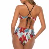 Floral print bikini swimsuit, halter neck and high-waisted, perfect for summer. Red and white floral design.