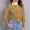 Women's leopard print lapel sweater with white turtleneck, winter fashion.