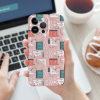 Pink floral and book pattern iPhone 15 case, PC plastic, precise cutouts, held by a woman