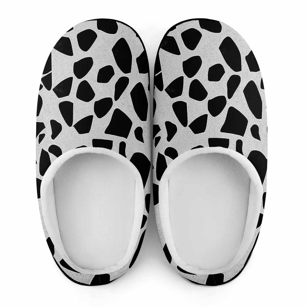 Cotton slippers with cow pattern, rubber sole for indoor wear.