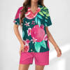 Silk pajama set with watermelon print top and pink shorts. Comfortable sleepwear.