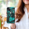 iPhone 13 case with green and black anime design held by a woman, TPU material, wireless charging compatible