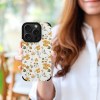 iPhone 15 fiber skin case with floral pattern, offering scratch protection and comfortable grip.
