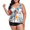 Split swimsuit for fat models: white floral top, black shorts. Comfortable & stylish.