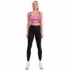 Woman in pink leopard print yoga vest and black leggings, comfortable and breathable fitness wear.