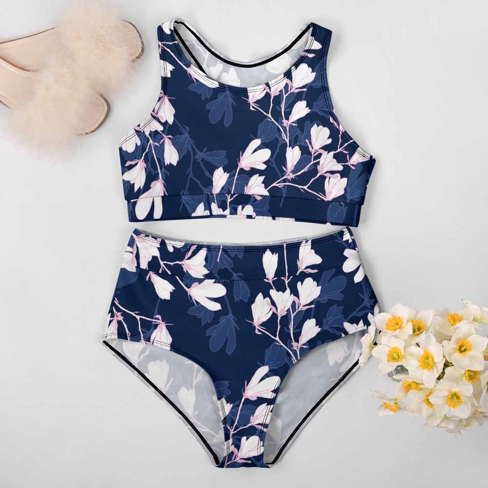 Navy floral high-waisted bikini swimsuit. Perfect for summer beach days. Stylish two-piece swimwear.