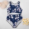 Navy floral high-waisted bikini swimsuit. Perfect for summer beach days. Stylish two-piece swimwear.