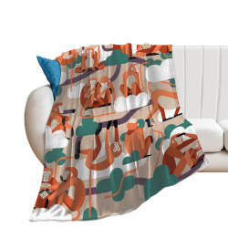 Soft flannel blanket with colorful pattern draped over a sofa, ideal for nap or relaxation.