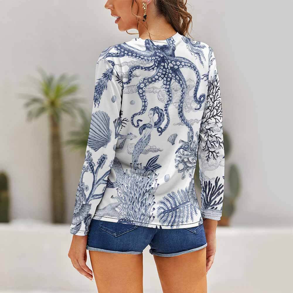 Women's white long sleeve shirt with blue pattern, featuring round neck, perfect for casual wear