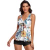 Sleeveless floral split swimwear with black bottom, polyester spandex blend, perfect for beach and vacation