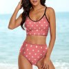 Pink polka dot bikini swimwear with high-waisted bottoms and triangle top