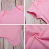 Pink baby bodysuit details: cotton fabric, comfortable design for babies 3-24 months.