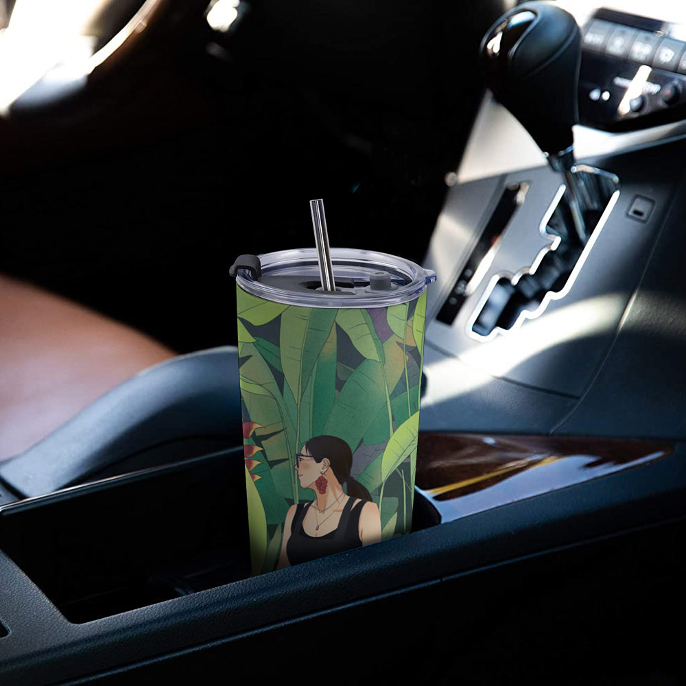 20 oz Stainless Steel Travel Mug with green leaves in car holder, perfect for car and outdoor use.