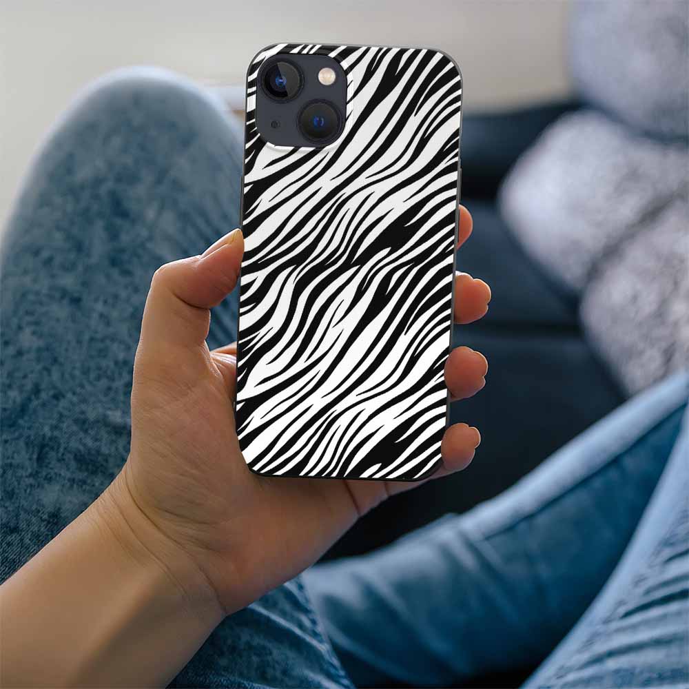 iPhone 13 case with zebra print design, black and white, TPU material, held by a person