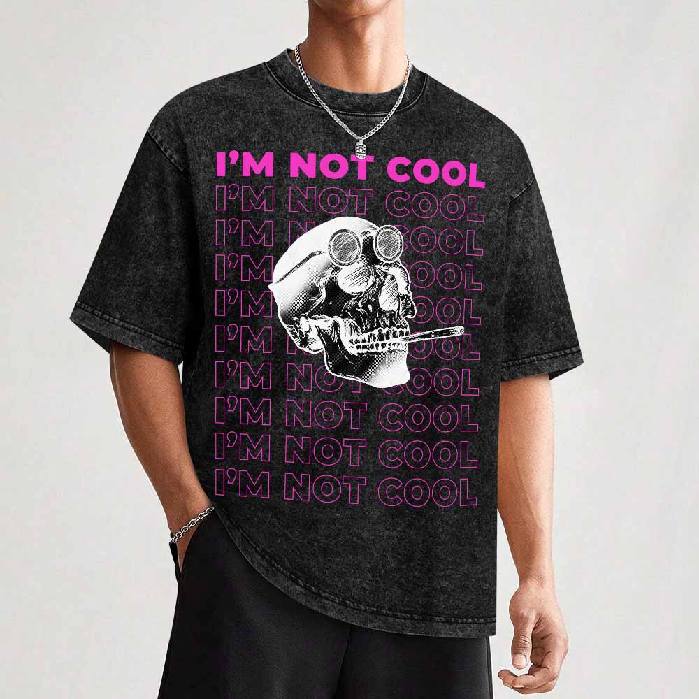 Hot vintage wash off shoulder short-sleeved T-shirt with skull graphic and "I'M NOT COOL" text, cotton fabric.