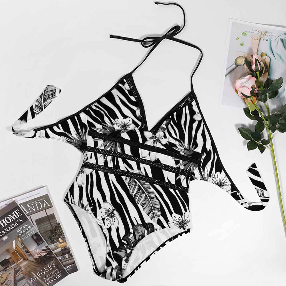Plus Size Zebra Print Halter Neck Swimsuit. Wrap design for flattering fit, perfect for beach or pool.