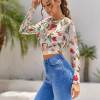Floral print backless crop top, open back design, long sleeve, polyester spandex blend, for casual wear.