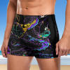 Black men's swim trunks with teal "Beach" design, made from polyester and spandex, quick-drying, perfect for swimming
