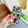 iPhone 13 fiber skin case with colorful geometric pattern, scratch-resistant.
