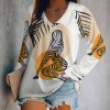 Women's long sleeve V-neck tee with artistic print, polyester and spandex blend