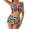 Leopard print two-piece bikini swimsuit with ruffled top and high-waisted bottoms.