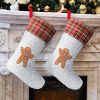 Christmas stockings with gingerbread man on fireplace, holiday decor