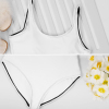White one-piece swimsuit with black trim, perfect for beach and pool, polyester material, U-back design