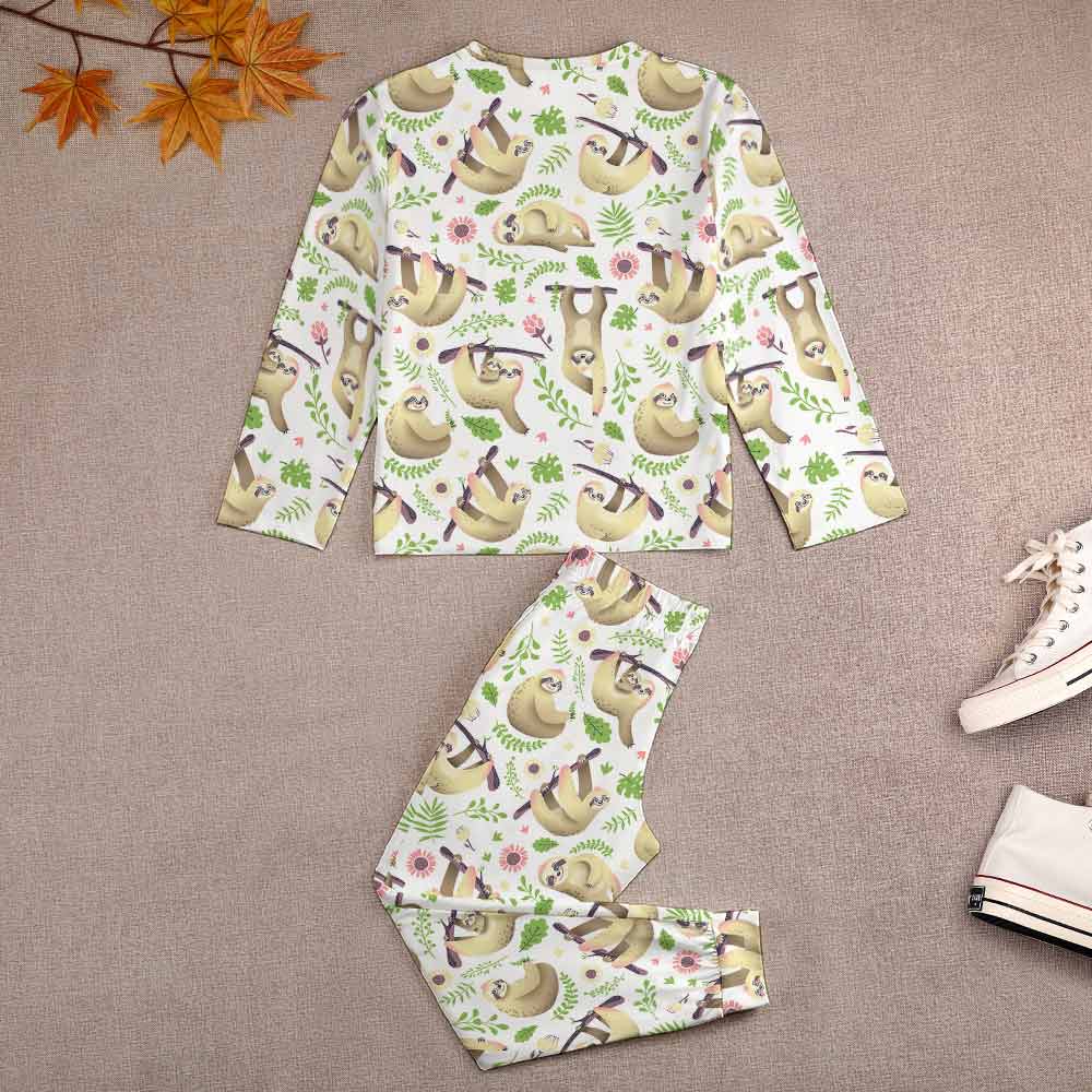 Boy's dinosaur print pajama set, soft polyester and spandex blend, crew neck design.