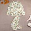 Boy's dinosaur print pajama set, soft polyester and spandex blend, crew neck design.