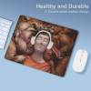Durable leather mouse pad with person wearing headphones, ideal for gaming or office use.