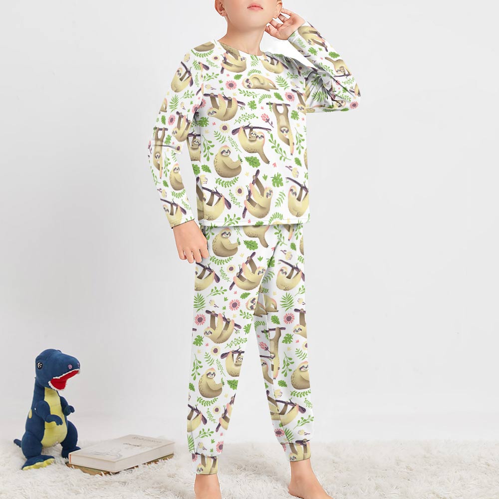 Boy's pajama set with dinosaur print, made of soft polyester and spandex blend, comfortable crew neck design.