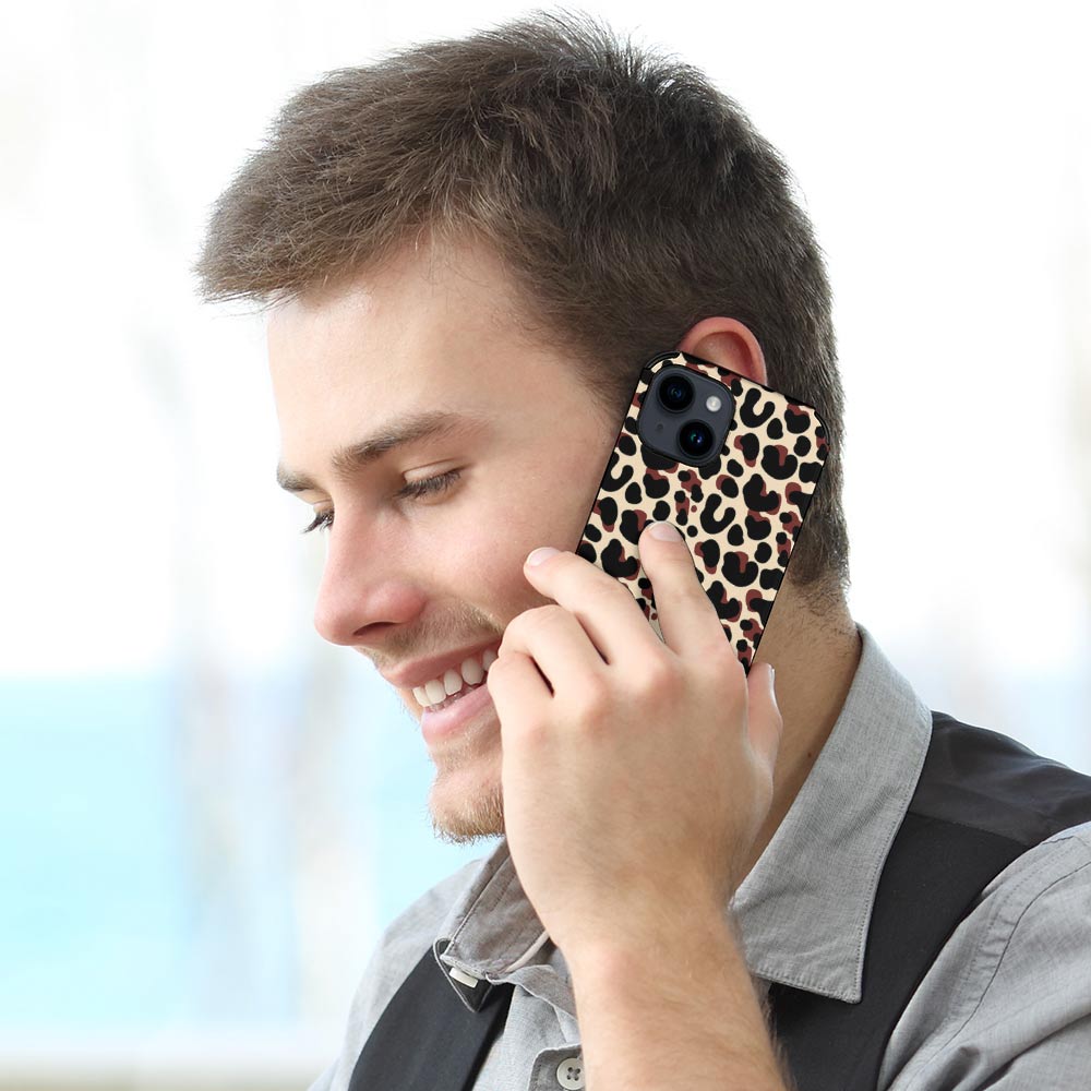 Man on iPhone 14 with leopard print fiber skin case, scratch-resistant and stylish.