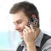 Man on iPhone 14 with leopard print fiber skin case, scratch-resistant and stylish.