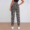 Women's leopard print sweatpants, featuring elastic waistband and drawstring, perfect for casual wear, made of polyester.